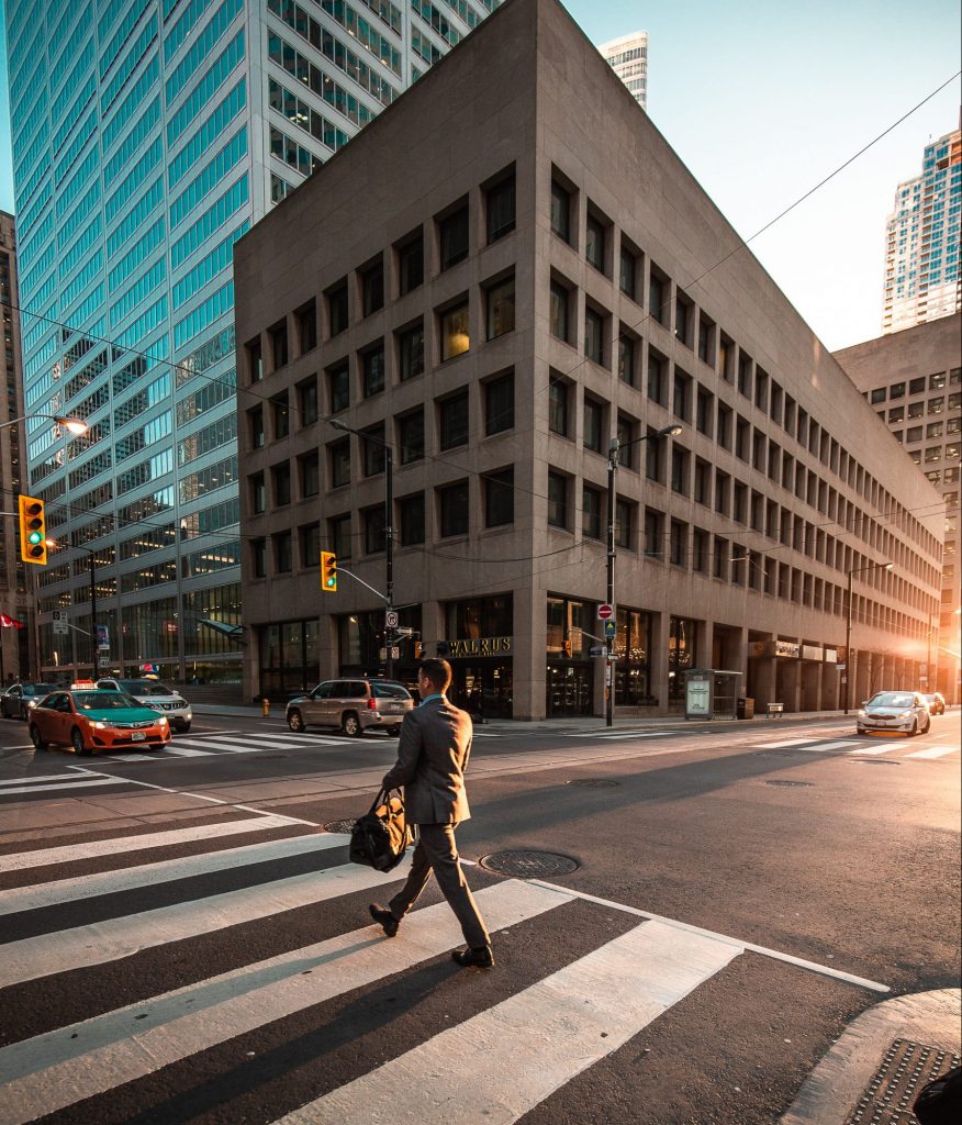man crossing pedestrian lane